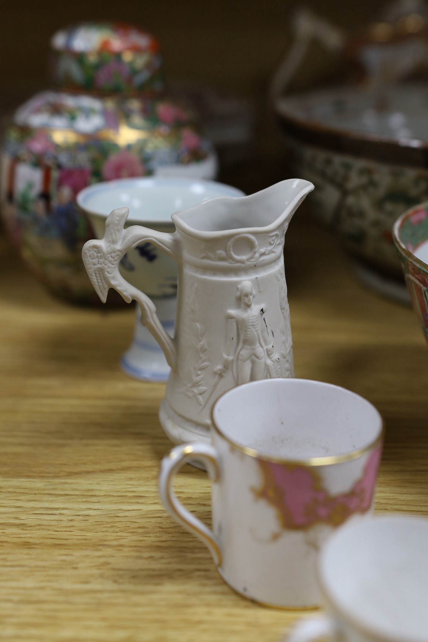 A group of mixed ceramics and an enamel brush